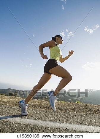 Runner training on a road in Malibu View Large Photo Image Stock Photograph - Runner training on a road in Malibu. Fotosearch
