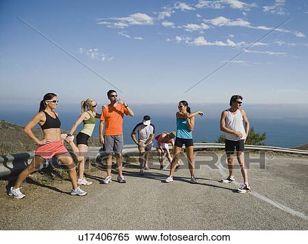 Runners stretching on a road in Malibu View Large Photo Image Stock Photography - Runners stretching on a road in Malibu. Fotosearch