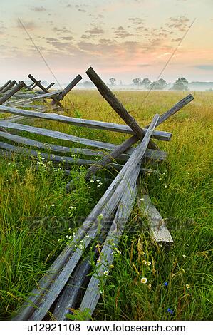Rustic fence in field View Large Photo Image Stock Photo - Rustic fence in field. Fotosearch