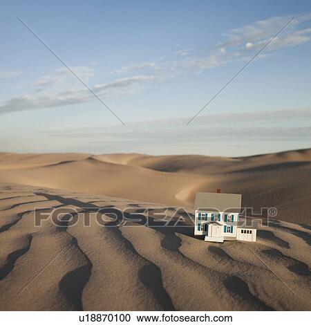 Stock Image - Scale model home in desert. Fotosearch