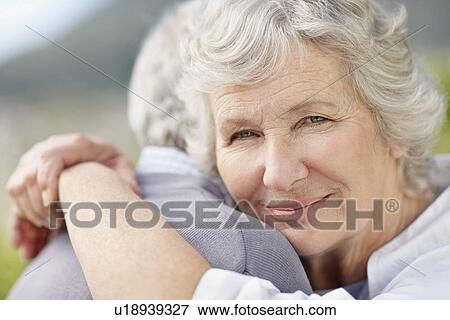 Stock Photo - Senior couple hugging. Fotosearch