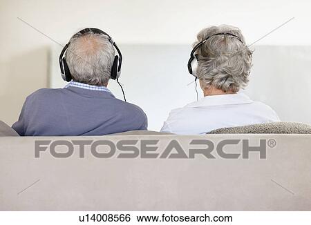 Senior couple wearing headphones View Large Photo Image Stock Photograph - Senior couple wearing headphones. Fotosearch