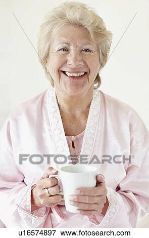 Stock Photo - Senior woman wearing a bathrobe. Fotosearch