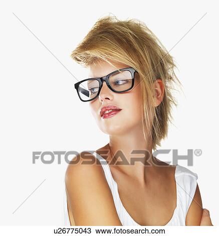 Stock Image - Sensuous blond woman wearing glasses. Fotosearch