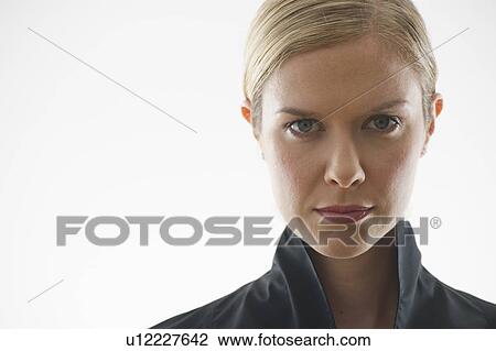 Stock Image - Serious blond woman. Fotosearch