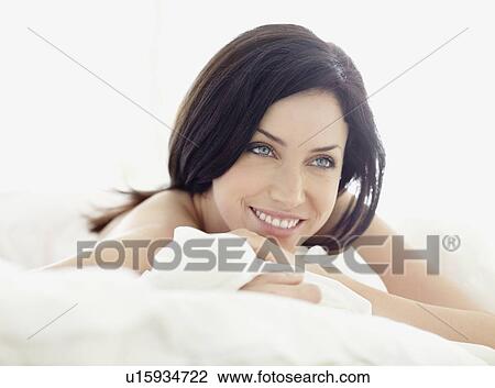 Sexy woman lying on bed View Large Photo Image Stock Image - Sexy woman lying on bed. Fotosearch