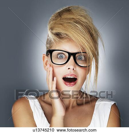 Stock Image - Shocked glamorous blond woman. Fotosearch