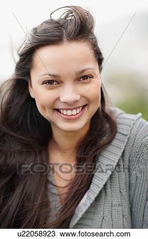 Stock Image - Smiling attractive brunette woman. Fotosearch
