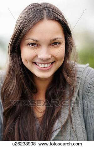 Stock Photo - Smiling attractive brunette woman. Fotosearch