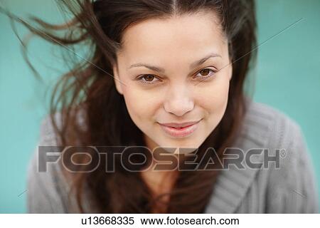 Stock Photography - Smiling attractive brunette woman. Fotosearch