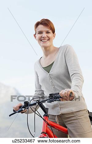 Smiling cyclist View Large Photo Image Stock Photo - Smiling cyclist. Fotosearch