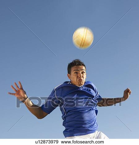 Soccer player heading the ball View Large Photo Image Stock Photo - Soccer player heading the ball. Fotosearch