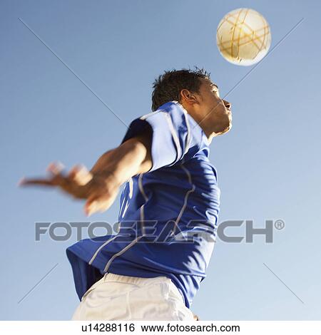 Soccer player heading the ball View Large Photo Image Stock Photograph - Soccer player heading the ball. Fotosearch