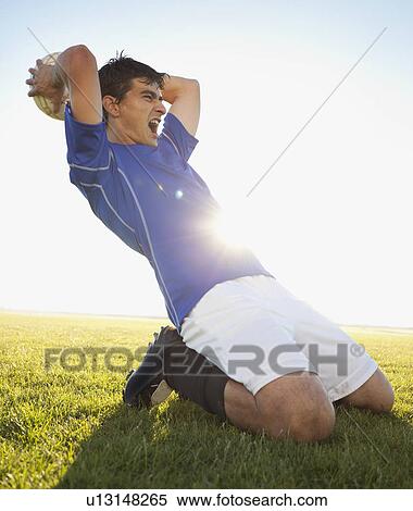 Soccer player throwing ball View Large Photo Image Stock Photography - Soccer player throwing ball. Fotosearch
