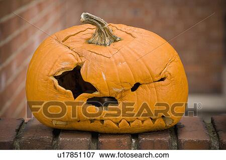 Stock Photo - Squished jack-o-lantern. Fotosearch