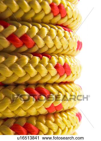 Stock Image - Stack of yellow rope. Fotosearch