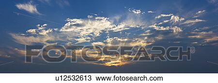 Sunset behind clouds View Large Photo Image Stock Image - Sunset behind clouds. Fotosearch