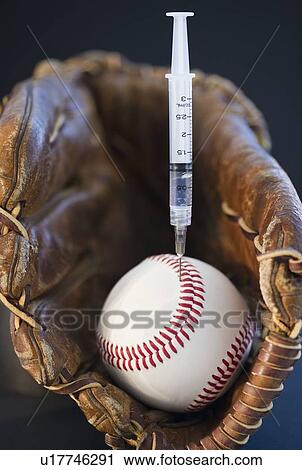 Stock Image - Syringe in baseball. Fotosearch