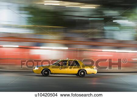 Taxi cab driving at night View Large Photo Image Picture - Taxi cab driving at night. Fotosearch