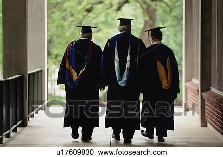 Stock Image - Three adult graduates. Fotosearch