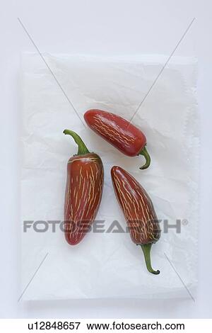 Stock Photo - Three spicy fresno peppers. Fotosearch