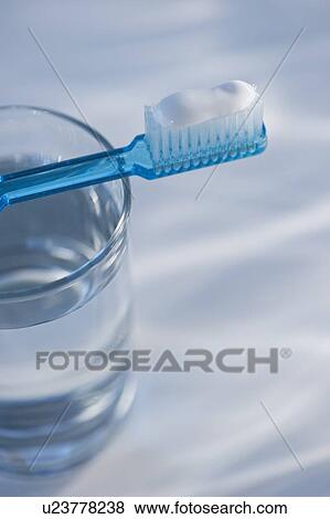 Toothbrush and glass of water View Large Photo Image Stock Photo - Toothbrush and glass of water. Fotosearch