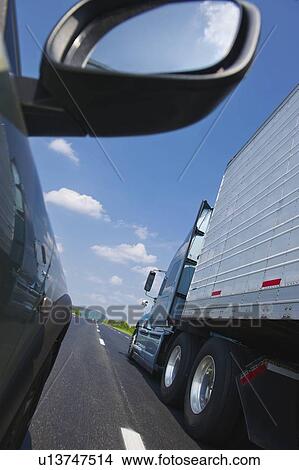Truck and car on highway View Large Photo Image Picture - Truck and car on highway. Fotosearch