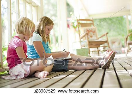Two girls writing letters View Large Photo Image Stock Photo - Two girls writing letters. Fotosearch