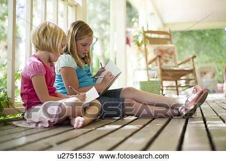 Two girls writing letters View Large Photo Image Stock Photo - Two girls writing letters. Fotosearch