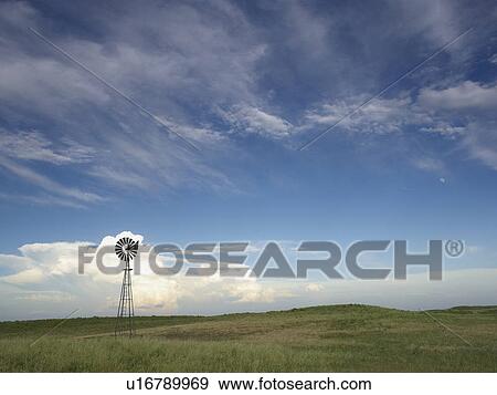 Windmill in field View Large Photo Image Stock Photo - Windmill in field. Fotosearch