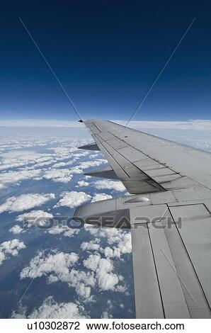 Stock Image - Wing on airplane. Fotosearch
