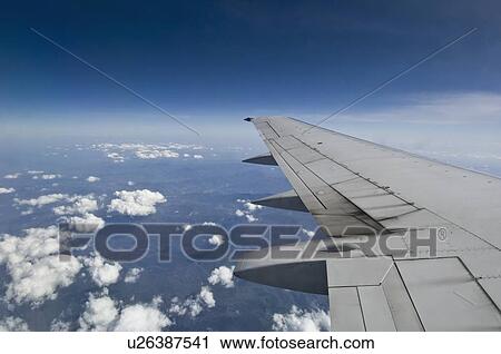 Stock Image - Wing on airplane. Fotosearch