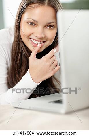 Picture - Woman browsing the internet. Fotosearch