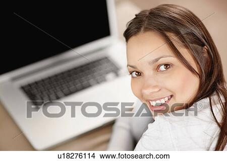 Picture - Woman browsing the internet. Fotosearch