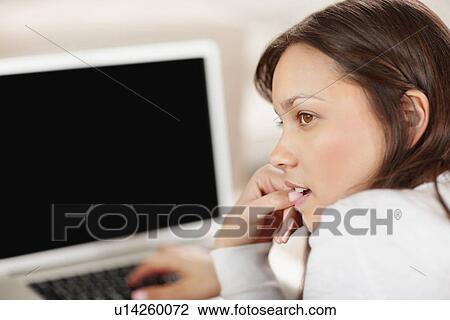 Woman browsing the internet View Large Photo Image Stock Image - Woman browsing the internet. Fotosearch