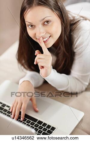 Stock Image - Woman browsing the internet. Fotosearch