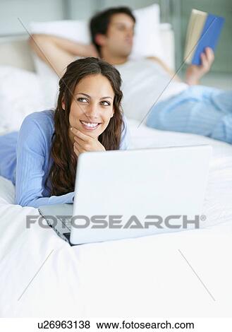 Woman browsing the internet View Large Photo Image Stock Photo - Woman browsing the internet. Fotosearch