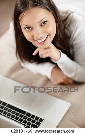 Stock Photo - Woman browsing the internet. Fotosearch