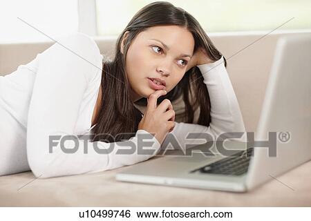 Woman browsing the internet View Large Photo Image Stock Photograph - Woman browsing the internet. Fotosearch