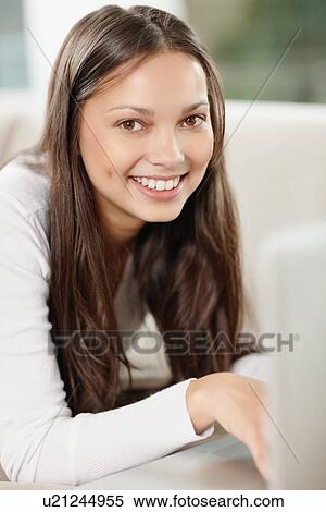 Woman browsing the internet View Large Photo Image Stock Photography - Woman browsing the internet. Fotosearch