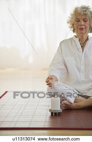 Woman meditating View Large Photo Image Picture - Woman meditating. Fotosearch