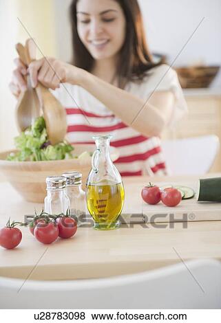Stock Photo - Woman preparing salad. Fotosearch