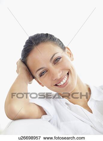 Stock Photo - Woman relaxing on couch. Fotosearch