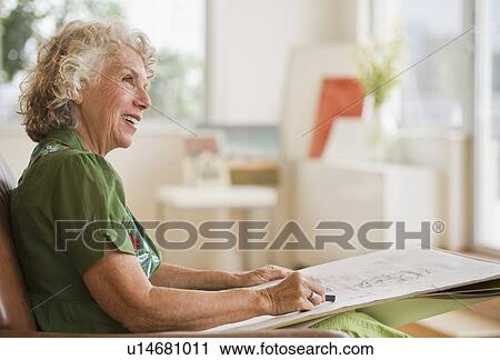 Woman sketching a drawing View Large Photo Image Stock Image - Woman sketching a drawing. Fotosearch