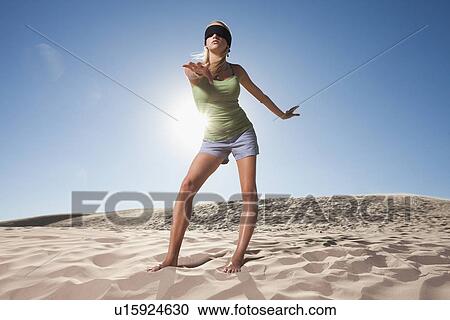 Woman wearing blindfold in the desert View Large Photo Image Stock Image - Woman wearing blindfold in the desert. Fotosearch