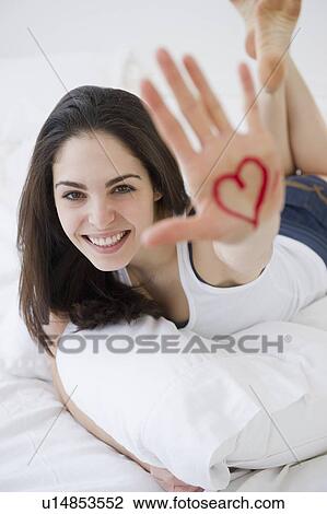 Woman with a heart drawn on her hand View Large Photo Image Stock Image - Woman with a heart drawn on her hand. Fotosearch