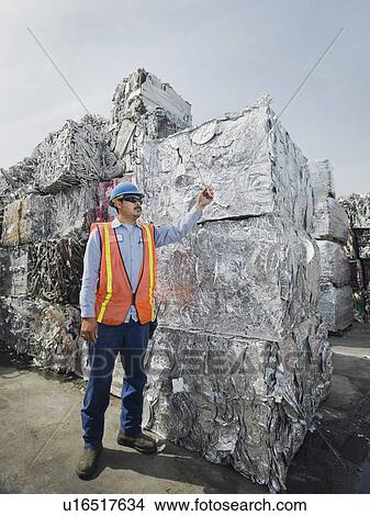 Worker at recycling plant View Large Photo Image Picture - Worker at recycling plant. Fotosearch