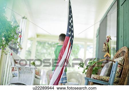 Young boy carrying American flag View Large Photo Image Picture - Young boy carrying American flag. Fotosearch