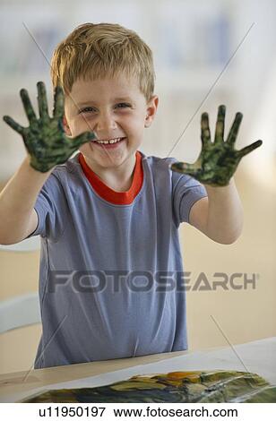 Young boy finger painting View Large Photo Image Stock Photo - Young boy finger painting. Fotosearch