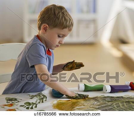 Young boy finger painting View Large Photo Image Stock Photograph - Young boy finger painting. Fotosearch